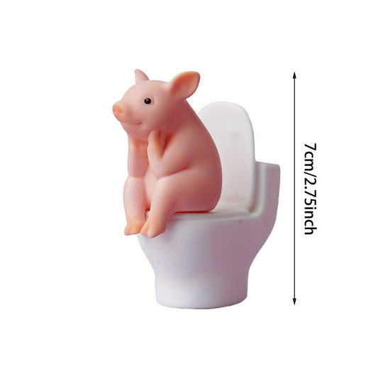 Whimsical Pink Pig Figurine on White Toilet - Playful PVC Bathroom Decor with Green Foliage Background, Perfect for Indoor & Outdoor Use, Indoor Decor | Playful Design | PVC Figurine, Bathroom Decor And Accessories